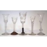 Five wine glasses, two with bell bowls, air twist stems, one with mercury twist and engraved bowl,