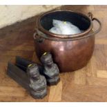 Pair of cast iron fire dogs moulded with bust of Lorrainne and a copper swing handle cooking pot. No