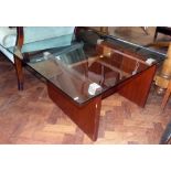 Thick plate glass coffee table, 90cm square on mahogany veneered H-frame. No condition reports for