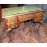 George III style knee hole desk of four short and one long drawer on cabriole legs with inset top (