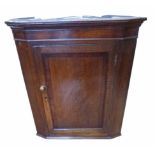 George III oak and cross banded corner cupboard with shaped interior shelves. No condition reports