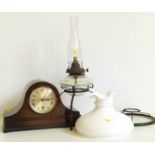 Oak Westminster chime mantel clock and a hanging oil lamp No condition reports for this sale