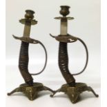 Pair of candlesticks made from sabre grips. No condition reports for this sale