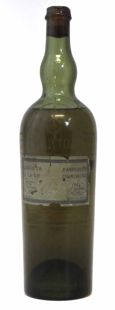 Chartreuse liqueur, the label reading 'Liqueur Fabrique a la Gde Chartreuse Fabrique' the bottle