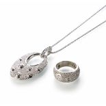 An 18ct white gold pave set diamond pendant and chain with matching ring. The oval modern design