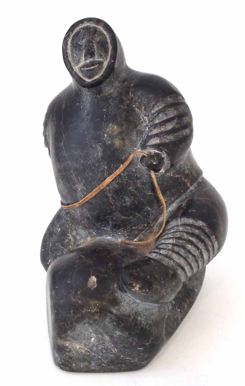 Carved soapstone figure probably Isah Sheeq, depicting an Inuit sitting on a rock, E9774 to base, - Image 2 of 5