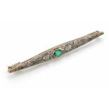 Art Deco emerald and diamond set torpedo shaped bar brooch, the central pentagon shaped step cut