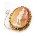 A Victorian oval shell cameo brooch, the shell cameo carved with a classical winged diety statue