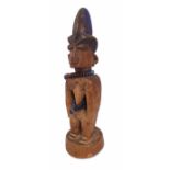 Yoruba Ibeji female figure, carved wood, beads and pigment, 31.5cm high Provenance: collected by the