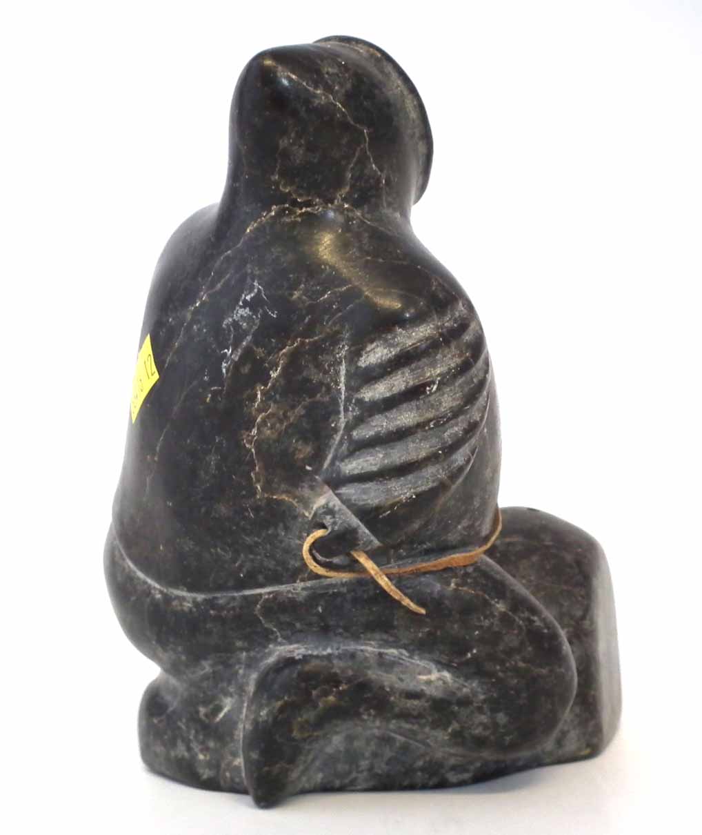 Carved soapstone figure probably Isah Sheeq, depicting an Inuit sitting on a rock, E9774 to base, - Image 4 of 5