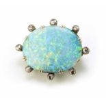 A circa 1900 oval opal and diamond set brooch, the opal flat polished blue-green colour, measuring