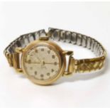 A Ladies Derrick 9ct yellow gold wristwatch on a plated expanding bracelet. No condition reports for