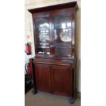 Victorian mahogany bookcase on cupboard. No condition reports for this sale.