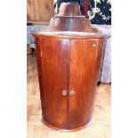 George III mahogany bow-front corner cupboard No condition reports for this sale.