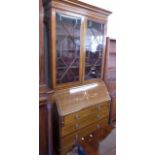 Edwardian mahogany and inlaid bureau bookcase. No condition reports for this sale.