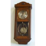 Early 20th century oak 8-day wall clock. No condition reports for this sale.