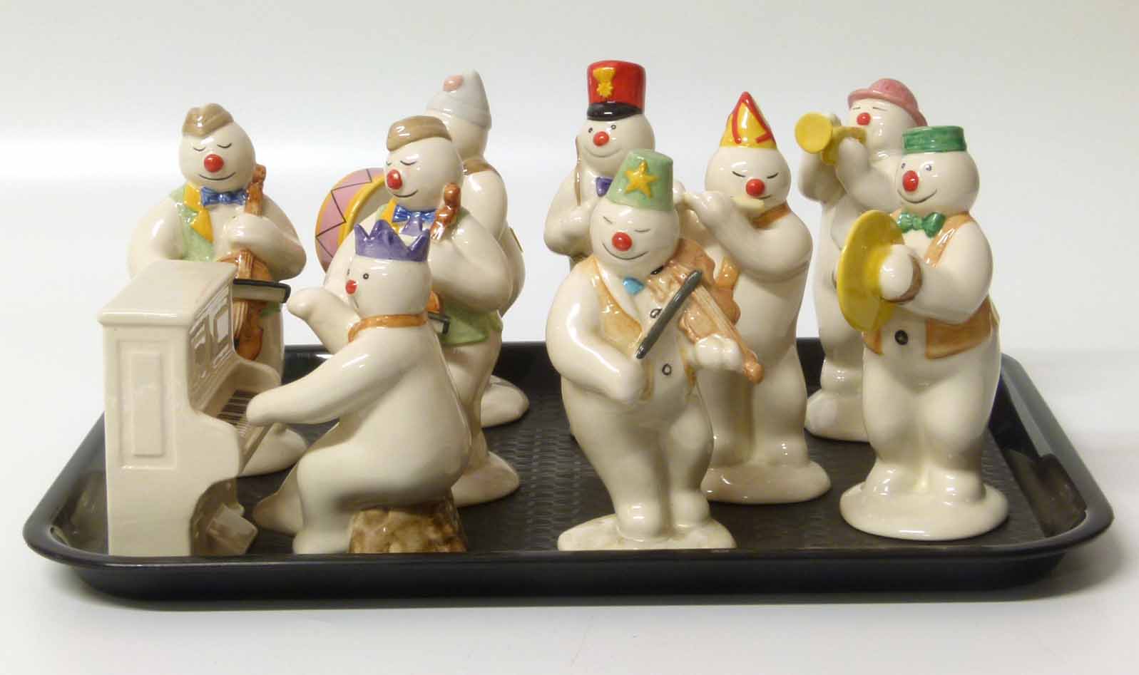 Royal Doulton Snowman band, to include two Cellists DS17, Pianist DS12 and Piano DS13, Violinist