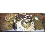 A large assortment of high quality clock parts, including two brass faces with brass spandrels and