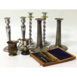 Pair of Art Nouveau pewter candlesticks, 2 pairs of plated candlesticks, a small plated mug and a