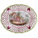 Faience pierced oval dish, painted with figures dancing to music, F.R. 1732 monogram to base, 19th