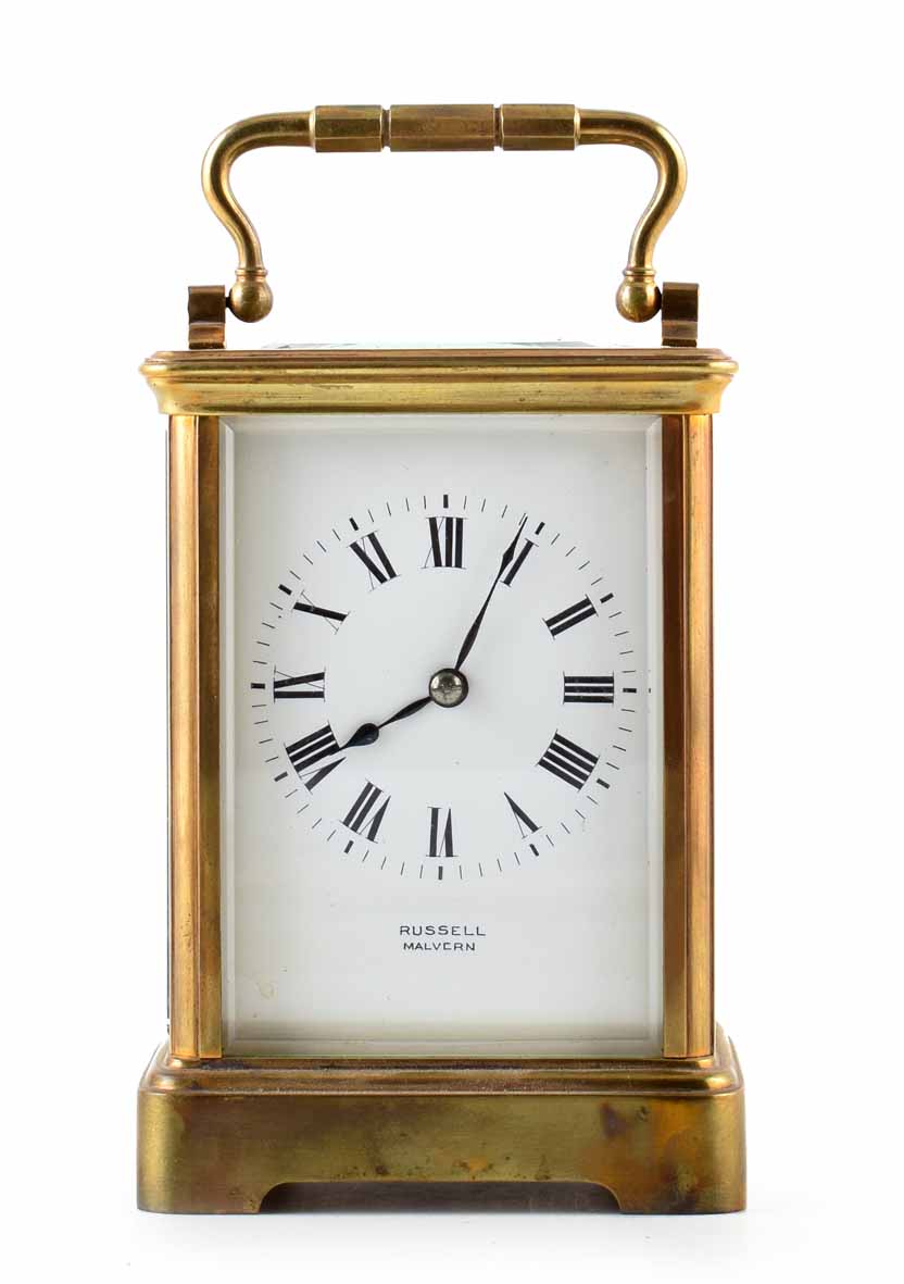 A late 19th century English carriage clock with brass face. Dial signed with makers name; '