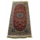 20th century silk and cotton Asian rug, madda field with central medallion, light brown border