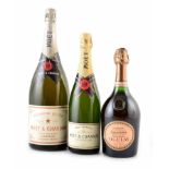Three bottles of Champagne: Laurent Perrier 'Oil of Ulay' Rose Champagne (750ml), a magnum of Moet &
