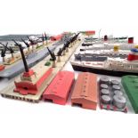 A collection of Triang Minic ships, Breakwaters, Quay Straights, Storage tanks and buildings to