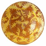 Slipware bowl, decorated with a stylised leaf pattern, early 19th century, 29cm diameter For