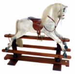 Rocking horse by H. Wakefield Boston, painted dapple grey, with walnut and mahogany turned stand,