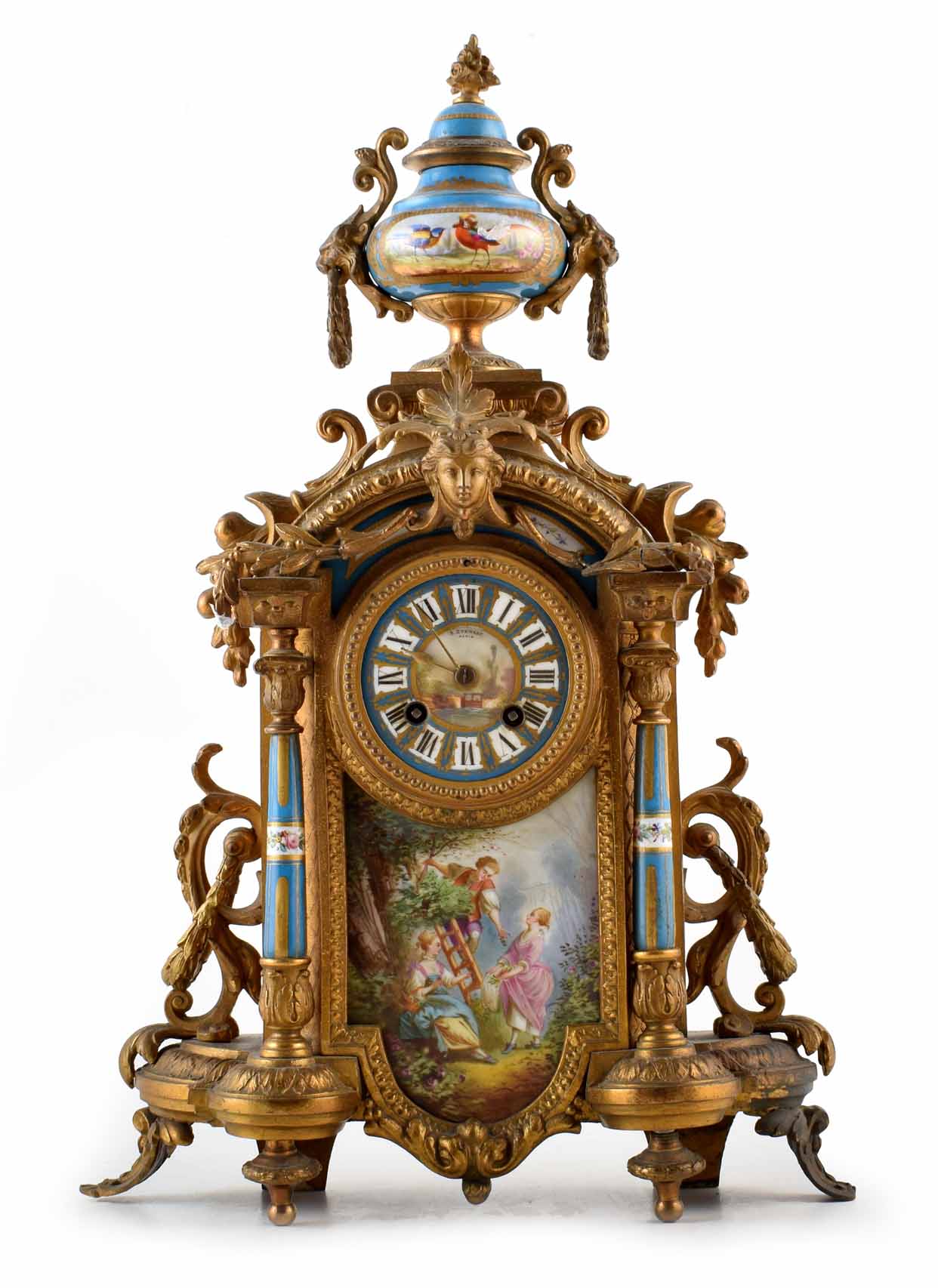 A 19th century French Ormolu mantel clock, with swags of flowers framing a porcelain dial with Roman