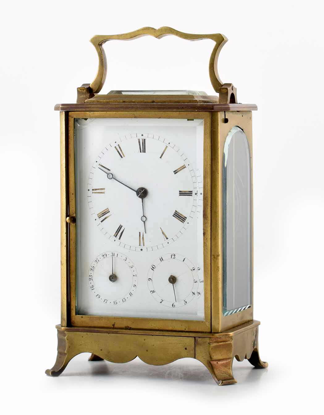 A 19th century German carriage clock with brass case, white enamel face with Roman numeral chapter