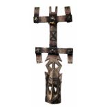 Dogon Kanaga mask, Mali, wood, pigment and hide string, 89cm high Provenance: collected by the