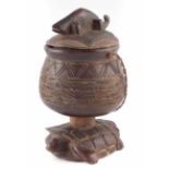 African Asante lidded vessel with fibre handle and chameleon finial No condition reports for this