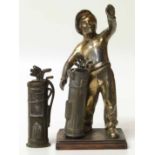 Novelty cigarette lighter spelter figure of golfer with bag and one other American golf bag