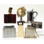 Table top cigarette lighter of a lidded tankard and seven other novelty table lighters. No condition