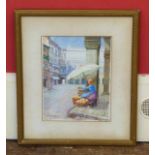 Framed watercolour of orange seller on continental street signed Godfrey Hughes No condition reports