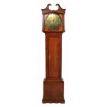 A late 18th century longcase clock with oak case. Doric brass topped columns support a double swan-