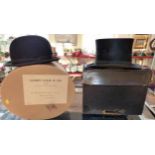 Top hat in case (approximately circumference 53cm). No condition reports for this sale.