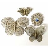 Three wirework butterfly brooches and a wirework and delft brooch No condition reports for this