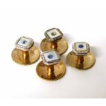 A set of four 9ct gold mother of pearl dress studs- stone missing from one No condition reports