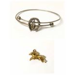 Gold horse riding charm and horseshoe bangle No condition reports for this sale.
