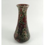 A Ruskin Pottery vase, of baluster form, decorated in a mottled red and green crystalline glaze,