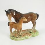 A Beswick model, of a bay mare and foal on shaped base, height 7.