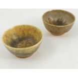 A pair of Ruskin pottery bowls, decorated in a mottled orange crystalline glaze, both dated 1930,