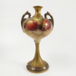 A Royal Worcester vase, the front decorated with fruit to a mossy background by Ricketts,