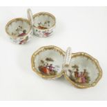 A 19th century German porcelain double condiment, the two circular bowls with central loop handle,