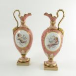 A pair of 19th century Minton porcelain ewers,