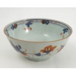 An Oriental bowl, decorated in reds and blues and with flowers, af, diameter 5.