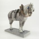 A Royal Copenhagen model, of a shire horse in harness, standing on a rectangular base, marked 471,